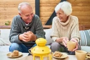 Elderly couple relaxing with tea at home in Columbus, Ohio.