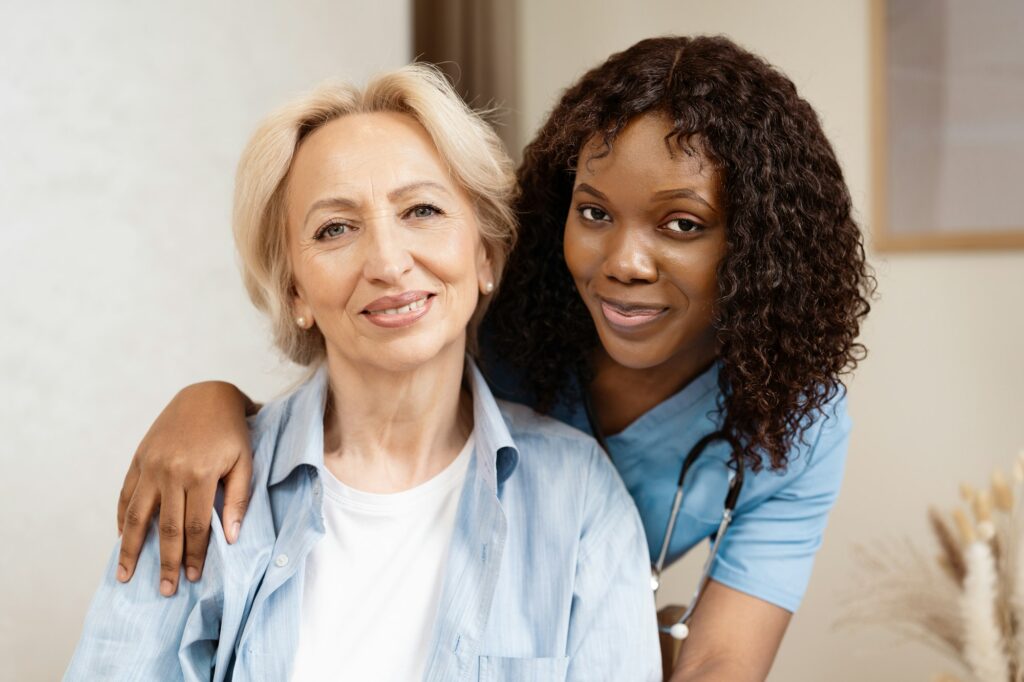 Caring Nurse Embracing Elderly Woman in Home Care Environment