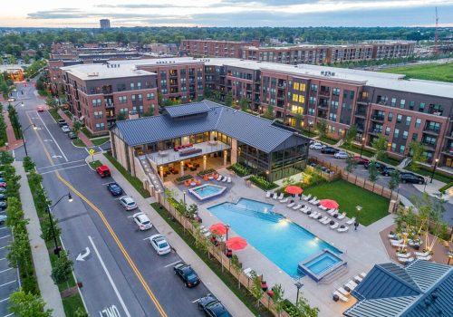 An aerial view of an apartment complex at dusk.